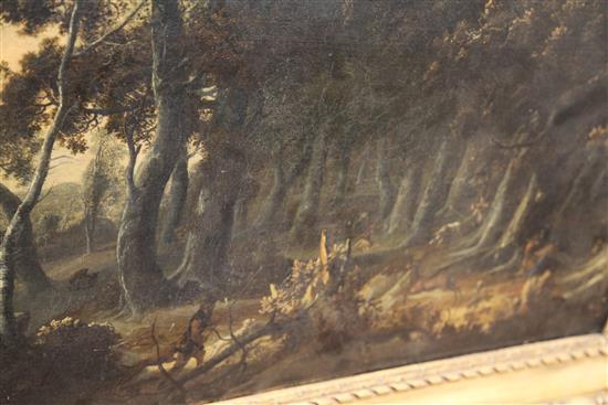 18th Century Flemish School An extensive wooded landscape with a stag hunt in the foreground 36 x 53in.